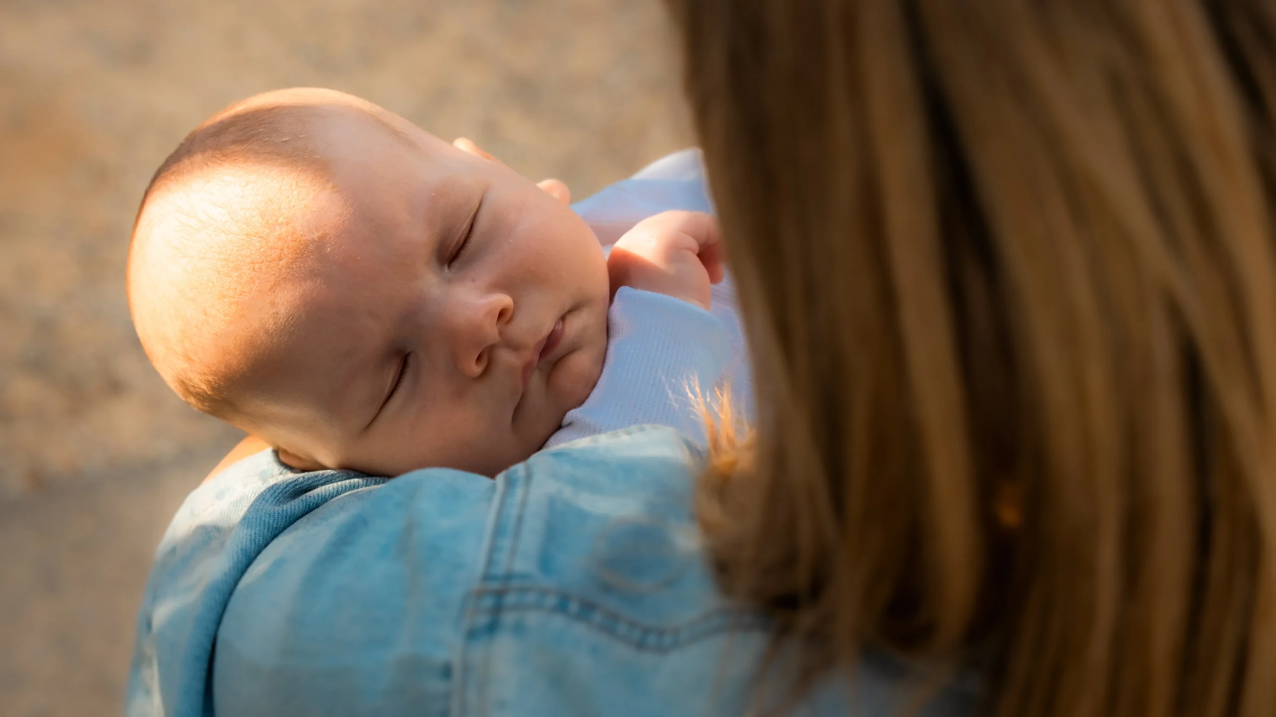 Christine supporting a new parent and baby in a warm home environment